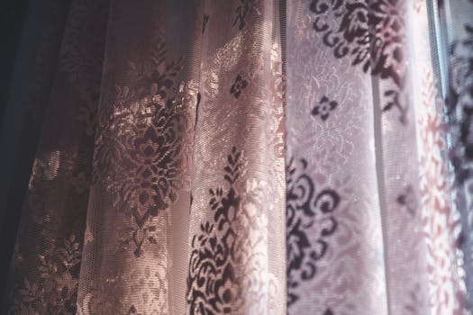 Close-up of vintage-style curtains with intricate patterns and soft lighting, creating an elegant and classic atmosphere.